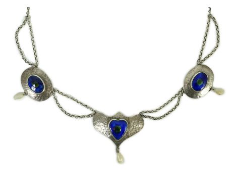 A stylish early 20th century sterling, enamel and baroque drop pearl set necklace, with shaped planished central motif and tw