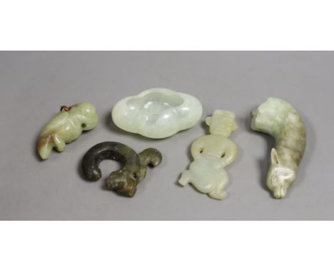 Four Chinese jade or hardstone carvings and a brushwasher, largest 9.2cm