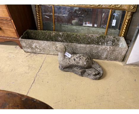 A rectangular garden planter, length 121cm together with a reconstituted stone otter garden ornament, height 29cm