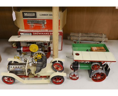 A boxed Mamod Showman's Engine and Lumbar wagon, and unboxed Steam Tractor and roadster- roadster 39 cms wide.