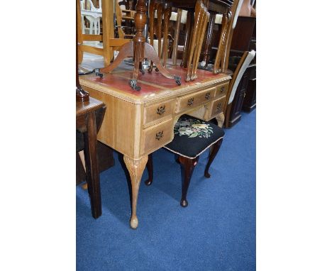 A WALNUT DRESSING TABLE, with five various drawers and red tooled leather top (sd)