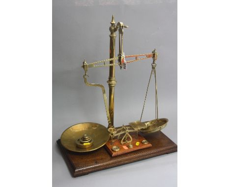 A SET OF MAW CLASS B BRASS BALANCE SCALES, with wooden drawer base and brass weights, together with a postal set of scales an