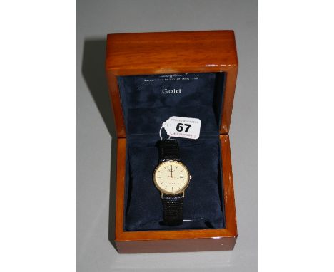 A 9CT ROTARY ELITE DATE WATCH, on leather strap, box and papers