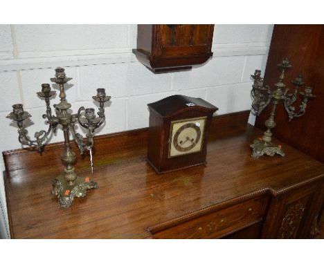 A PAIR OF BRASS FOUR TIER CANDELABRA, with foliate detail