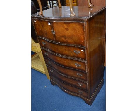 A WALNUT FINISH SERPENTINE TALLBOY, with five long drawers and a doubl;e door cupboard (key)