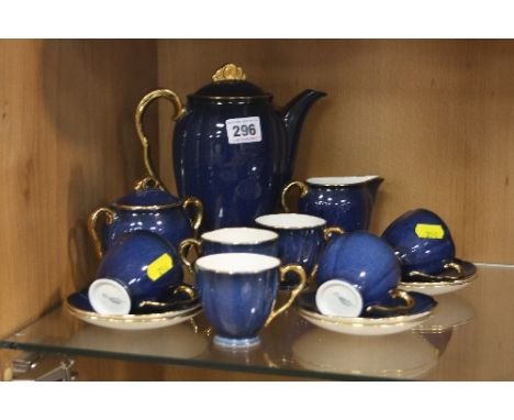 A CARLTONWARE BLUE WITH GILT RIM COFFEE SET, No.1582, comprising coffee pot (chip to base), covered sugar bowl, cream jug, si
