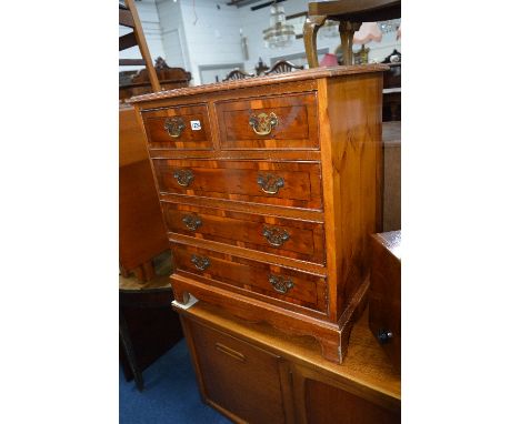 A MODERN YEW WOOD CHEST, of two short and three long drawers (sd)