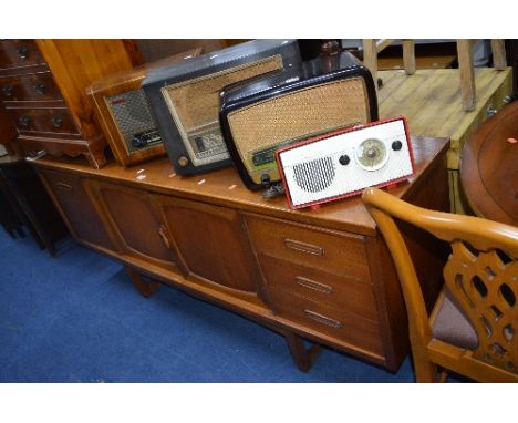 A LONG TEAK SIDEBOARD, with three drawers and central cupboard, approximate size width 183cm x depth 44cm x height 77cm and a