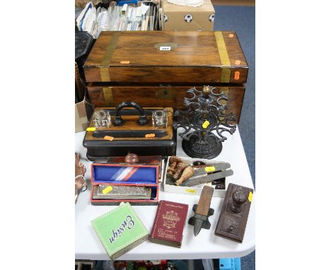 A WALNUT AND BRASS BOUND WRITING SLOPE, fitted interior, to include ink pots, sealing wax, pens etc, together with another in