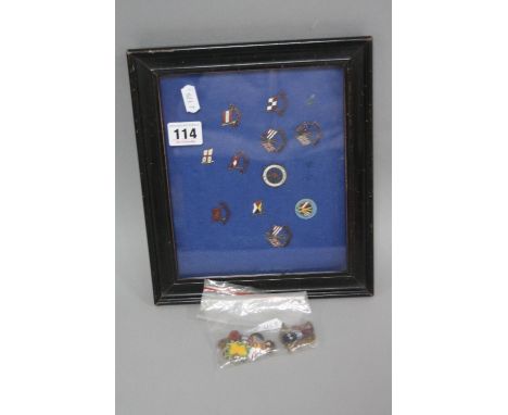 A SMALL DISPLAY CASE OF NAUTICAL ENAMEL BADGES, and eight 'Golly' badges