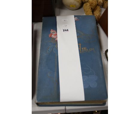 AN EARLY 20TH CENTURY POSTCARD ALBUM, containing topographical, Beauties, etc