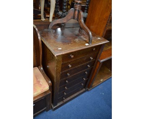 A 20TH CENTURY OAK WELLINGTON CHEST, of seven drawers (sd, losses)