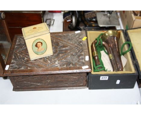 A CASED COPPER AND BRASS BUGLE, a carved work box and a Royal commemorative 'Tea' tin (3)