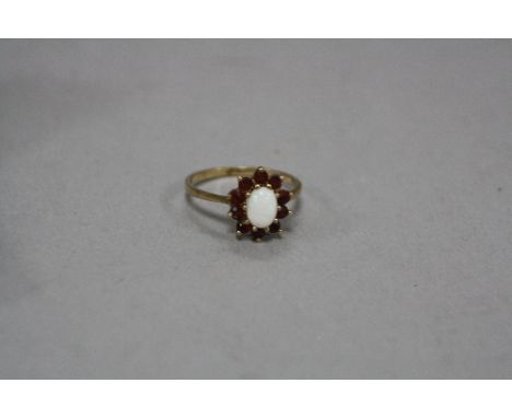 A 9CT OPAL AND RUBY RING, ring size P