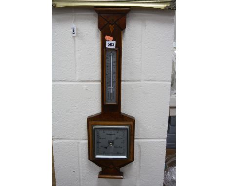 AN ART DECO WALNUT AND INLAID BAROMETER, with fitted thermometer
