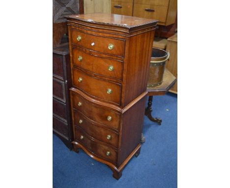 A MODERN MAHOGANY SERPENTINE CHEST ON CHEST, of six graduating drawers