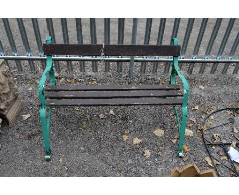 A PAINTED WROUGHT IRON GARDEN BENCH, with scroll detail and wooden slats, approximate length 120cm