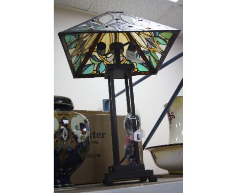 A BOXED MINSTER TIFFANY STYLE TABLE LAMP, coloured glass shade, labels still attached