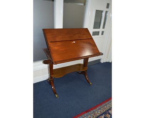 AN EARLY 19TH CENTURY MAHOGANY FOLIO STAND, hinged top with adjustable easel back, fitted circular candleholders to the front