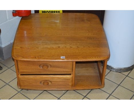 AN ERCOL ELM WINDSOR PANDORA'S BOX COFFEE TABLE, with two drawers