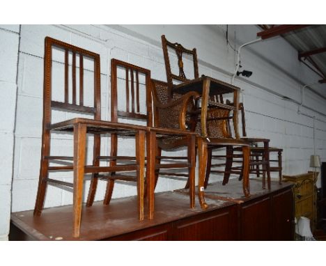 AN EDWARDIAN BERGERE ARMCHAIR, six other Edwardian chairs and a mahogany firescreen (sd) (8)