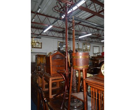 A CARVED MAHOGANY STANDARD LAMP, an oak planter on stand with brass banding and a modern bentwood style coat stand (3)