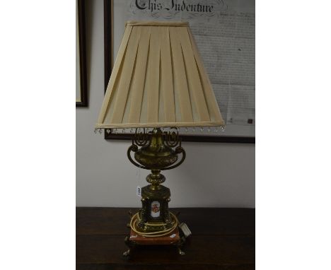 A GILT FRAMED TABLE LAMP, with four ceramic tile inserts on red veined marble base and shade