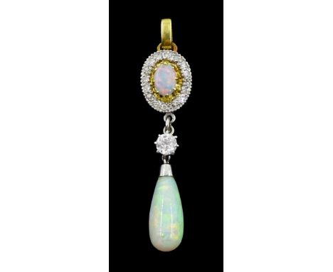 Gold and platinum opal and diamond pendant, the pear shaped opal cabochon suspending from a single old cut diamond of approx 