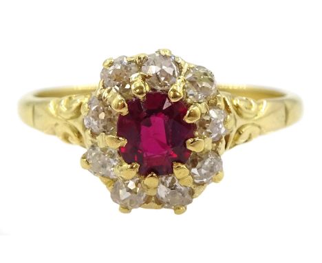 Early 20th century 18ct gold oval cut ruby and old cut diamond cluster ring, stamped, ruby approx 0.45 carat, total diamond w