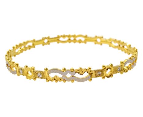 22ct gold pierced design bangle, with white gold highlightsCondition Report:Approx 16.48gm, tested 22ct, inner circumference 