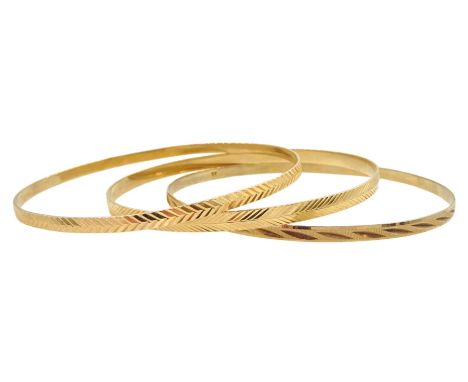 Two 17ct gold bangles and a 9ct gold bangleCondition Report:17ct approx 15.6gm, 9ct approx 4.65gm, all tested