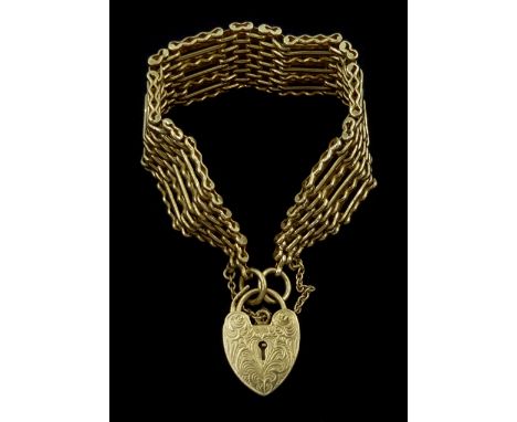 9ct gold seven bar gate bracelet, with heart locket clasp, London 1976Condition Report:Approx 33.65gm, length = 18.5cm, good 