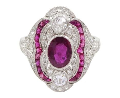 Platinum milgrain ruby and diamond ring, the oval cut ruby centre, with round brilliant cut diamond and calibre cut ruby surr