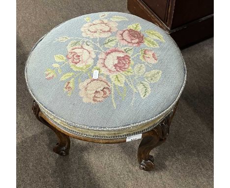Victorian circular stool with rose tapestry top raised on four short cabriole legs, top 40cm diam