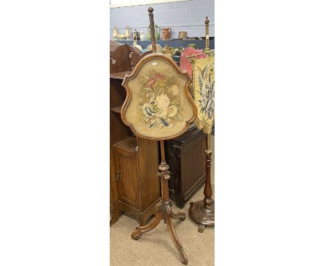 Victorian walnut framed pole screen set with a central floral tapestry panel, 147cm high