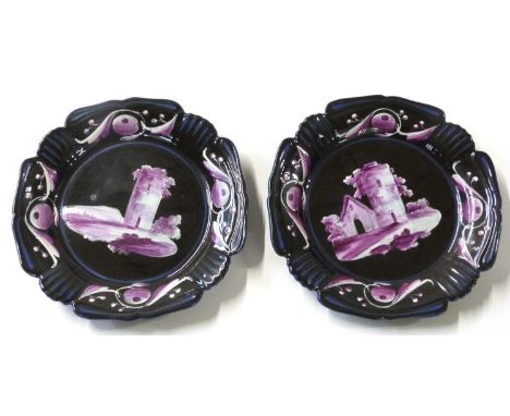 Two English pottery plates, early 19th century, the black ground with puce decoration of castles, possibly by Lakin &amp; Poo