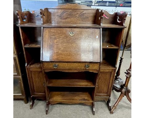 Late 19th century oak bureau bookcase in the Arts &amp; Crafts taste, with central drop down front flanked by shelves and sma