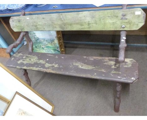 Late 19th/early 20th century cast iron framed garden bench, the naturalistic ends formed as branches and fitted with a wooden