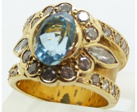 An 18ct gold ring set with a marquise cut aquamarine, marquise cut diamonds and round cut diamonds, 12.2g, size K&nbsp;