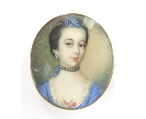 An early Victorian brooch set with a portrait miniature of a lady, 3.3 x 2.8cm&nbsp;