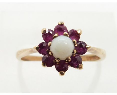 A 9ct gold ring set with an opal and rubies, 2.0g, size M&nbsp;