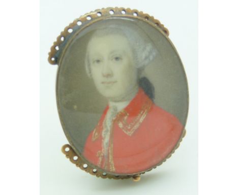 An early Victorian clasp set with a portrait miniature of a gentleman, 3 x 3.5cm