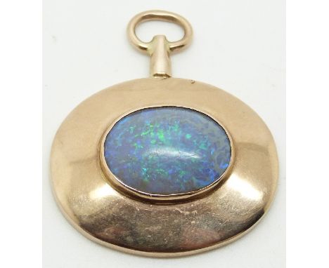 A yellow metal pendant set with an oval opal cabochon, 3.3 x 3.9cm&nbsp;