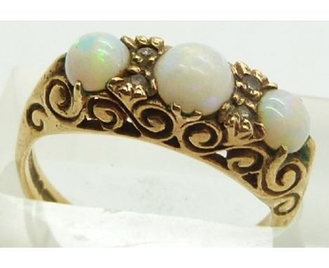 A 9ct gold ring set with opal cabochons, 3.6g, size N&nbsp;