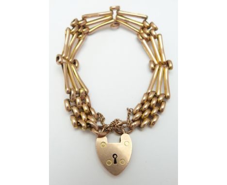 A 9ct rose gold gate bracelet with textured links and padlock clasp, 16.6g