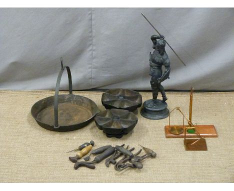 Two cast iron component holders, hanging frying pan, cobblers tools, set of post office scales and a figure of a soldier&nbsp
