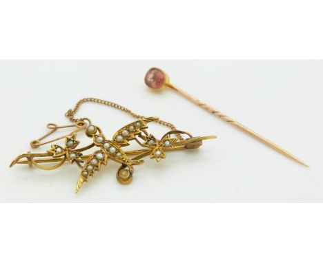 Victorian stick pin set with topaz and an Edwardian 9ct brooch in the form of a swallow set with seed pearls, 4.1g