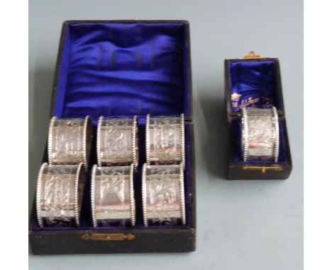 Cased set of six Edward VII hallmarked silver napkin rings, Chester 1907 maker&nbsp;Henry Williamson Ltd, together with a cas
