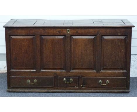 19thC oak coffer/chest with four fielded panel front and set with three drawers to base, each with a brass drop handle, 143 x