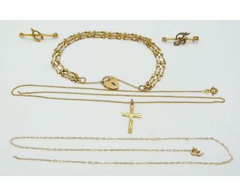 A 9ct gold gate bracelet, a 9ct gold cross, a Edwardian brooch set with seed pearls and a 9ct gold brooch in the form of a wi